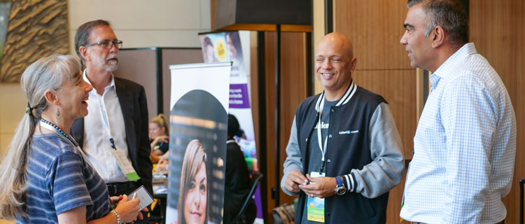 An attendee explores the LinkedIn exhibitor table